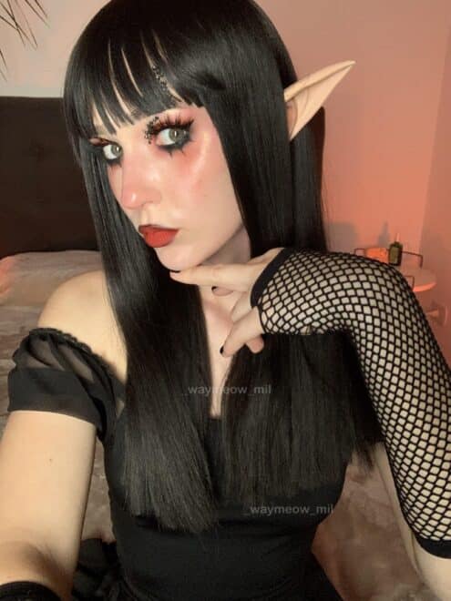 Face of an elf girl with dark makeup :’3